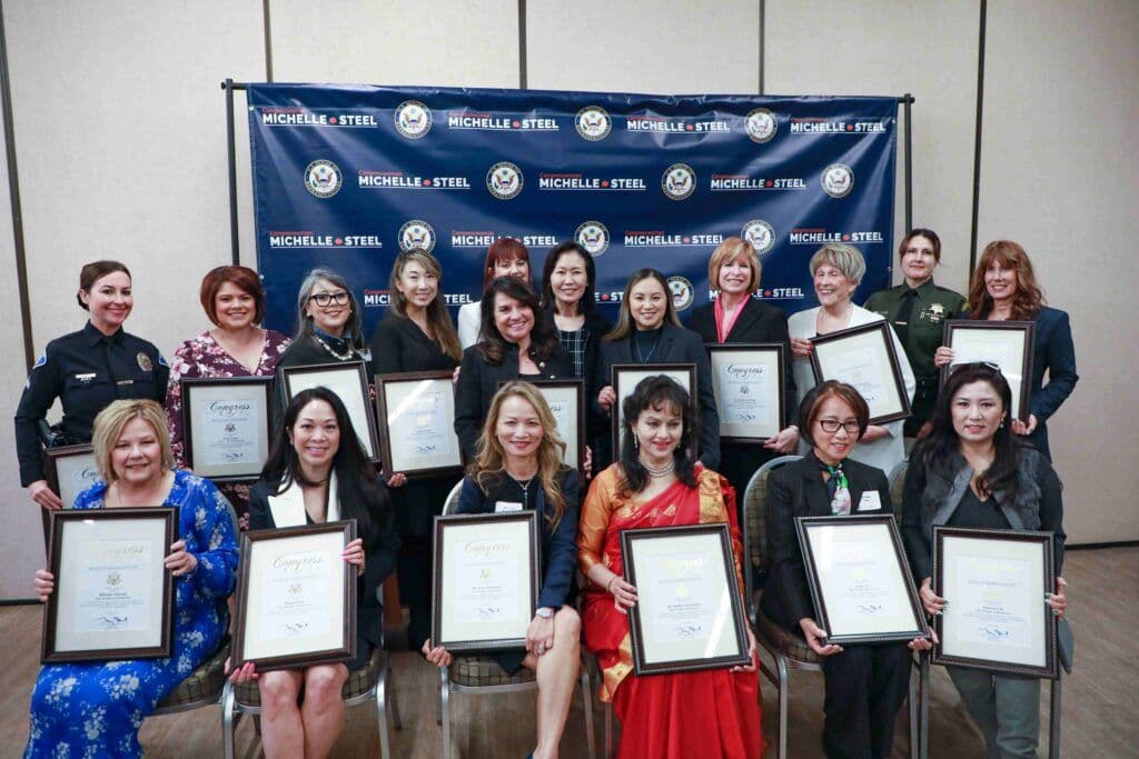 Angela with certificate of women of distinction