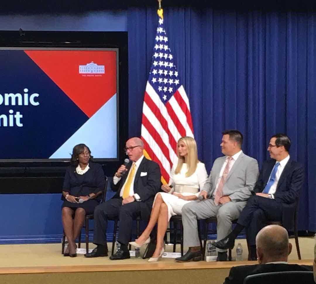 A panel discussion on stage at the White House Economic Summit